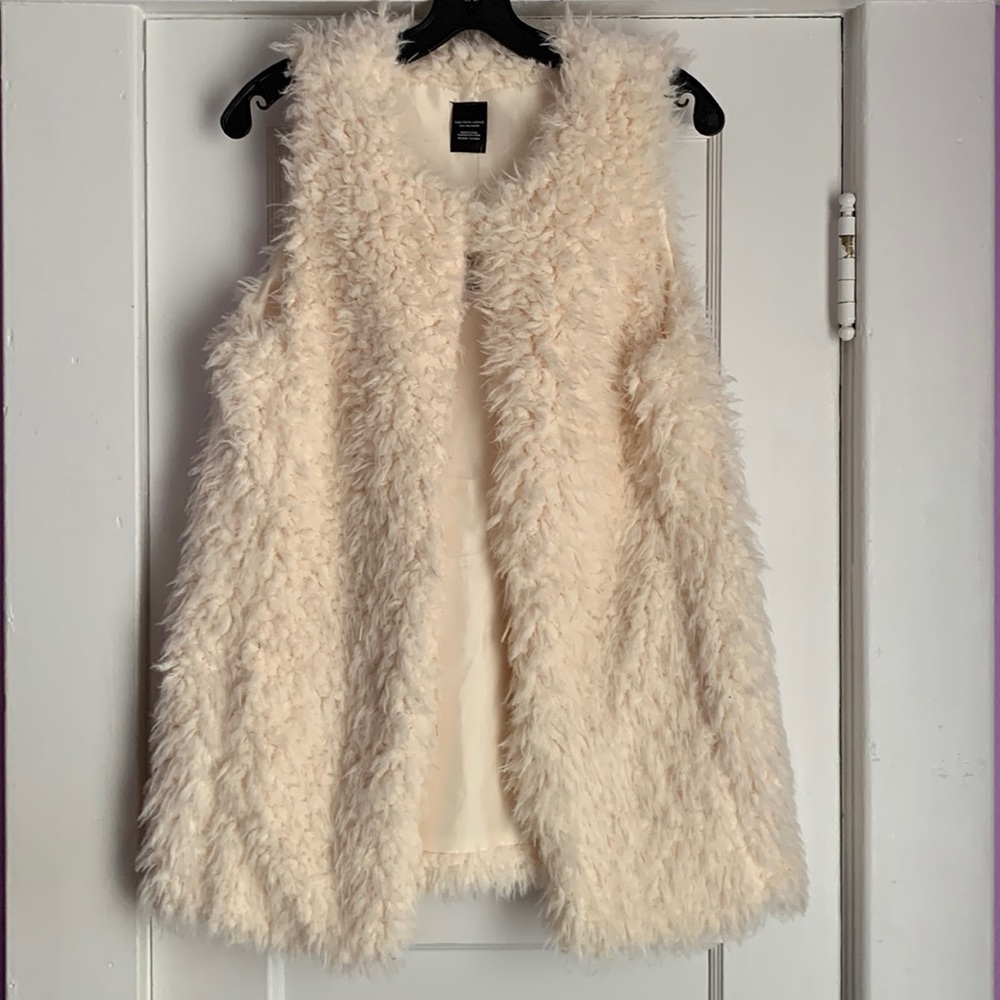 We have a Very Pretty comfortable XS/S Tan Vest.
